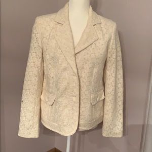 Ivory blazer with embroidery detail.